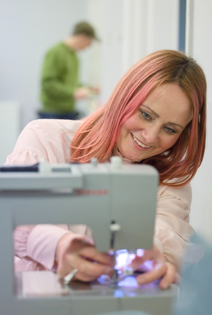 Estelle Pearce at a sewing machine